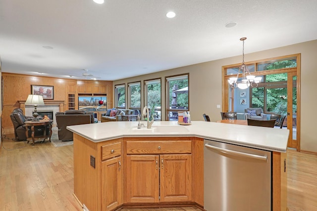 7569 Blackoaks Ln N, Maple Grove, MN 55311 - kitchen with dishwasher, open floor plan, light countertops, light wood finished floors, and a chandelier