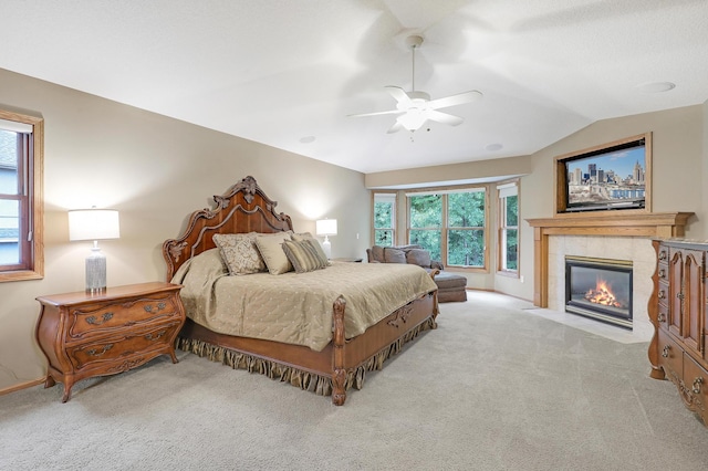 7569 Blackoaks Ln N, Maple Grove, MN 55311 - bedroom featuring carpet floors, lofted ceiling, a tile fireplace, and a ceiling fan