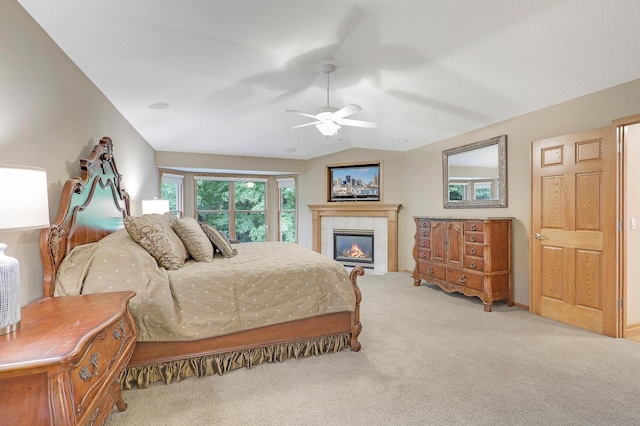 7569 Blackoaks Ln N, Maple Grove, MN 55311 - carpeted bedroom with a tile fireplace, lofted ceiling, and a ceiling fan
