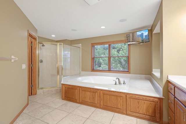 7569 Blackoaks Ln N, Maple Grove, MN 55311 - bathroom with a shower stall, a bath, tile patterned flooring, and vanity