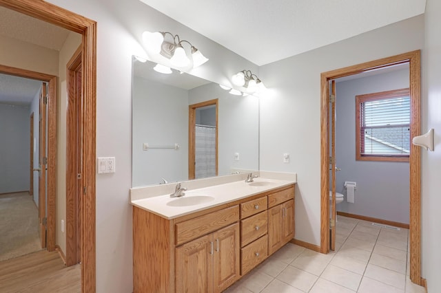 7569 Blackoaks Ln N, Maple Grove, MN 55311 - full bath featuring double vanity and tile patterned flooring