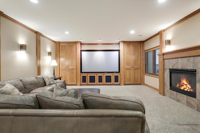 7569 Blackoaks Ln N, Maple Grove, MN 55311 - carpeted home theater featuring a tile fireplace, recessed lighting, and crown molding