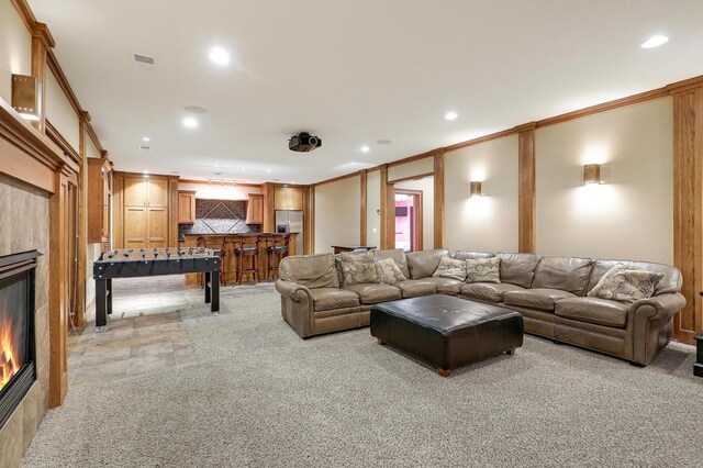 7569 Blackoaks Ln N, Maple Grove, MN 55311 - living room with a glass covered fireplace, recessed lighting, and light carpet