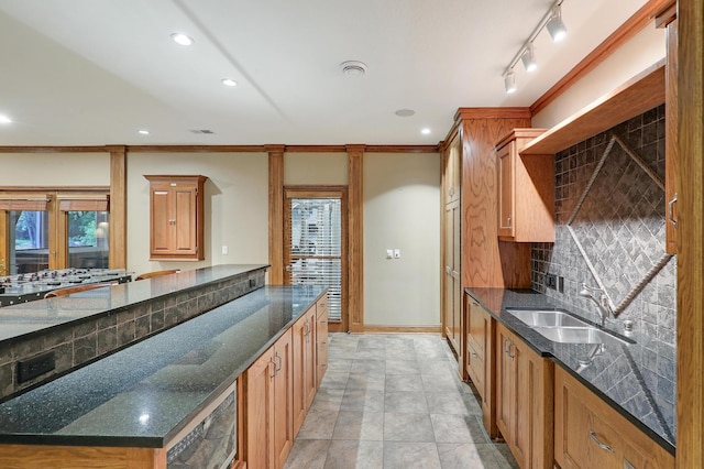 7569 Blackoaks Ln N, Maple Grove, MN 55311 - kitchen with decorative backsplash, recessed lighting, dark stone counters, stainless steel gas stovetop, and ornamental molding