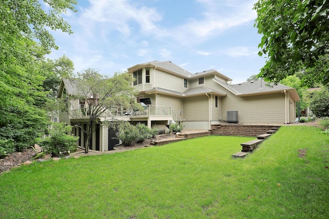 7569 Blackoaks Ln N, Maple Grove, MN 55311 - rear view of house with a lawn and a deck