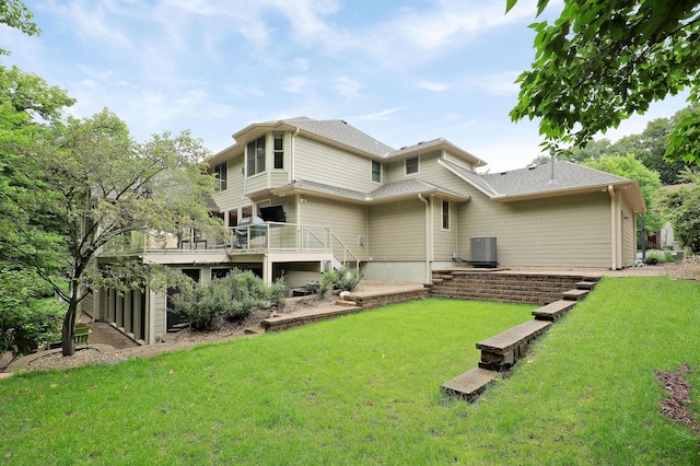 7569 Blackoaks Ln N, Maple Grove, MN 55311 - back of house with a lawn, a deck, and roof with shingles