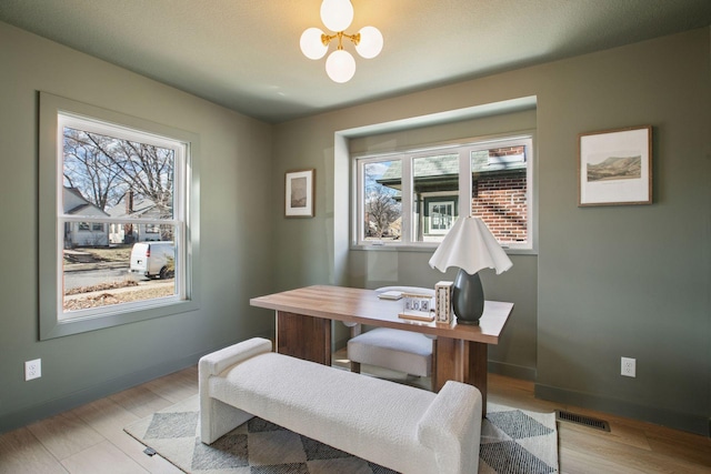 3520 27th Ave S, Minneapolis, MN 55406 - home office featuring plenty of natural light, a chandelier, and light wood-style flooring