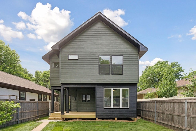 3520 27th Ave S, Minneapolis, MN 55406 - back of property featuring a fenced backyard and a wooden deck