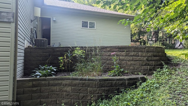 21021 Fresno St NW, Elk River, MN 55330 - view of side of property featuring a shingled roof and a cooling unit