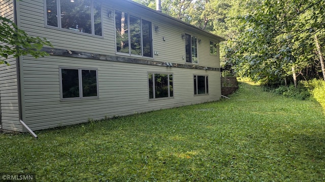 21021 Fresno St NW, Elk River, MN 55330 - view of side of property with a yard
