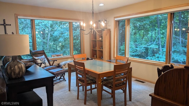 21021 Fresno St NW, Elk River, MN 55330 - carpeted dining space featuring a chandelier, healthy amount of natural light, and recessed lighting