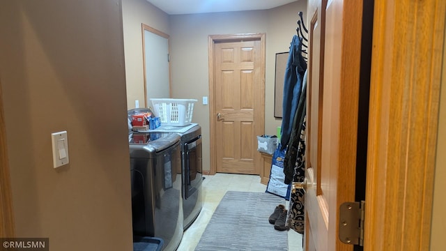 21021 Fresno St NW, Elk River, MN 55330 - laundry room featuring washing machine and dryer and light tile patterned floors