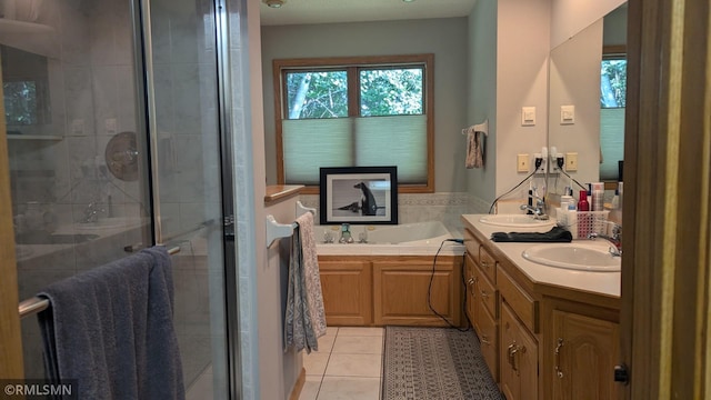 21021 Fresno St NW, Elk River, MN 55330 - full bathroom with tile patterned flooring, double vanity, a shower stall, and a garden tub
