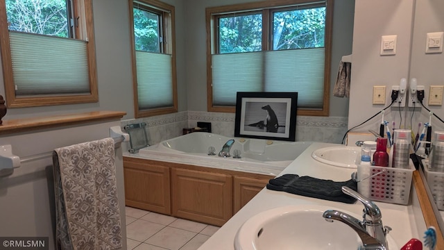 21021 Fresno St NW, Elk River, MN 55330 - bathroom featuring tile patterned floors, a bath, and double vanity