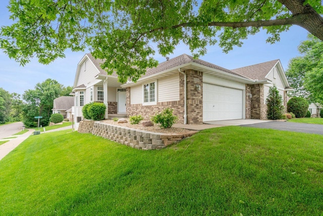13501 96th Pl N, Maple Grove, MN 55369 - view of front facade with driveway, a front lawn, brick siding, an attached garage, and a shingled roof