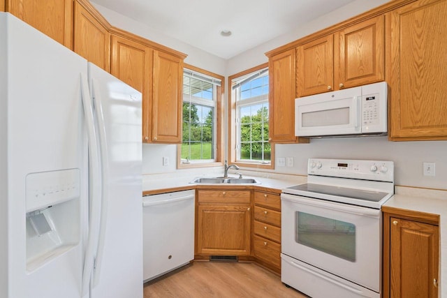 13501 96th Pl N, Maple Grove, MN 55369 - kitchen featuring white appliances, light wood finished floors, light countertops, brown cabinetry, and recessed lighting