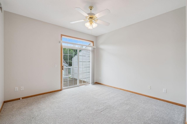 13501 96th Pl N, Maple Grove, MN 55369 - carpeted spare room with baseboards and a ceiling fan