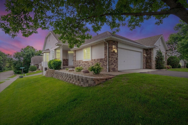 13501 96th Pl N, Maple Grove, MN 55369 - view of front of home featuring driveway, a yard, a garage, and brick siding