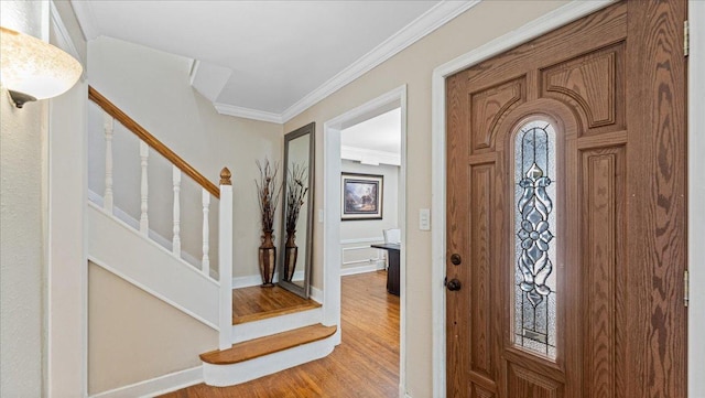 918 Trott Ave SW, Willmar, MN 56201 - entrance foyer featuring ornamental molding, light wood-style floors, and stairs