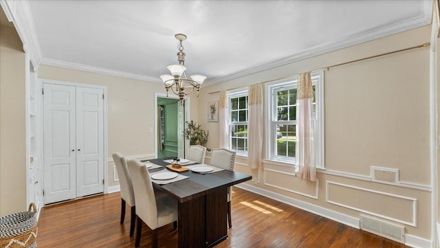 918 Trott Ave SW, Willmar, MN 56201 - dining space with a chandelier, crown molding, and dark wood-style flooring