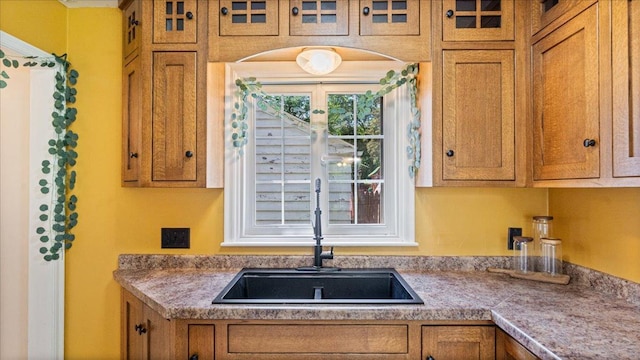 918 Trott Ave SW, Willmar, MN 56201 - kitchen with brown cabinetry and tile countertops
