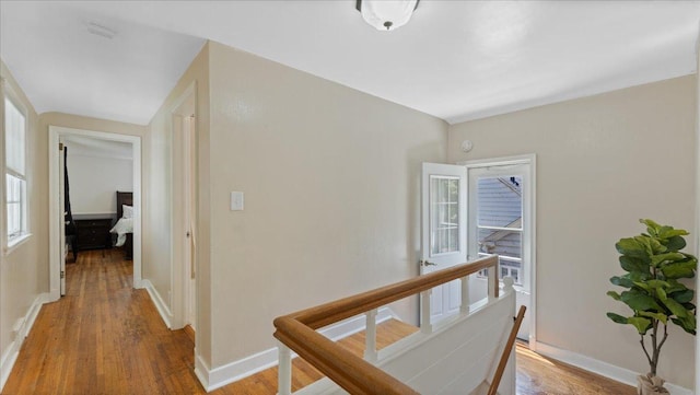 918 Trott Ave SW, Willmar, MN 56201 - corridor with an upstairs landing and light wood finished floors