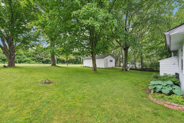 1671 Little Butternut Lake Ln, Luck, WI 54853 - view of grassy yard with an outdoor structure and view of scattered trees