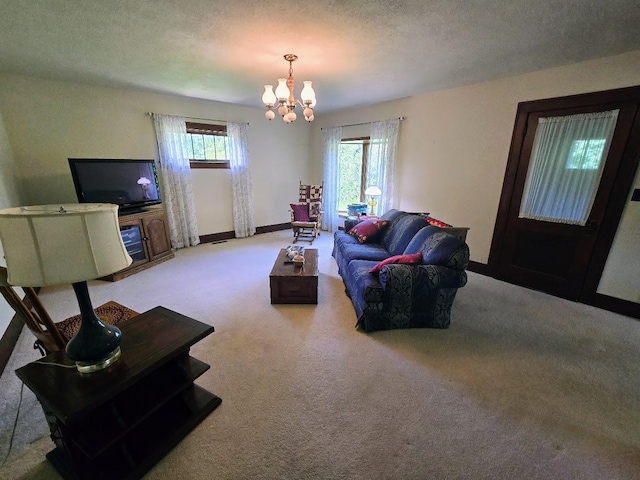 2047 60th Ave, Altona Twp, MN 56164 - carpeted living area featuring a chandelier and a textured ceiling