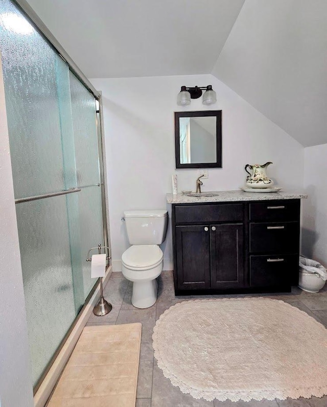 2047 60th Ave, Altona Twp, MN 56164 - bathroom featuring vaulted ceiling, vanity, a stall shower, and tile patterned floors
