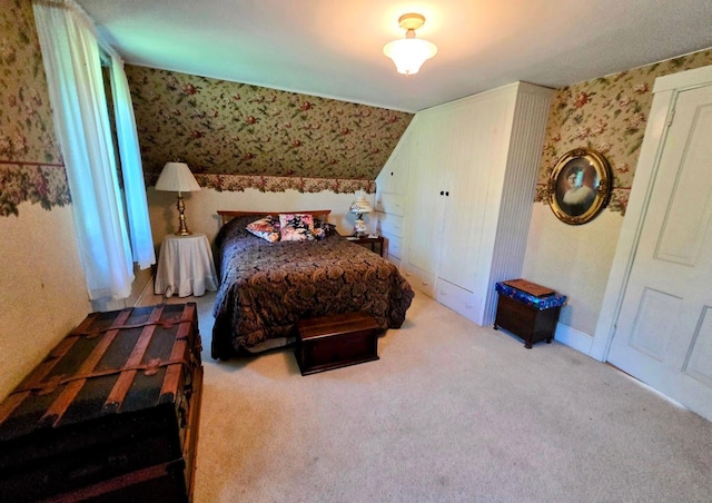 2047 60th Ave, Altona Twp, MN 56164 - bedroom with wallpapered walls, carpet flooring, and vaulted ceiling