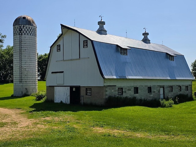 2047 60th Ave, Altona Twp, MN 56164 - rear view of property featuring a barn, a gambrel roof, a metal roof, a lawn, and an outdoor structure