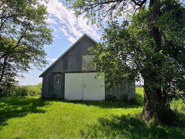 2047 60th Ave, Altona Twp, MN 56164 - view of home's exterior featuring a lawn and an outdoor structure