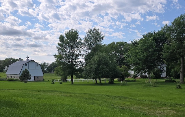 2047 60th Ave, Altona Twp, MN 56164 - view of green lawn with a barn and an outbuilding