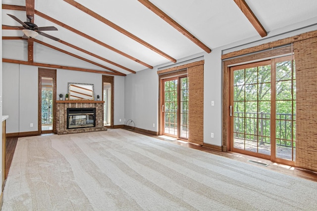 6230 Elm Ridge Cir, Corcoran, MN 55340 - unfurnished living room featuring carpet flooring, a fireplace, and a ceiling fan