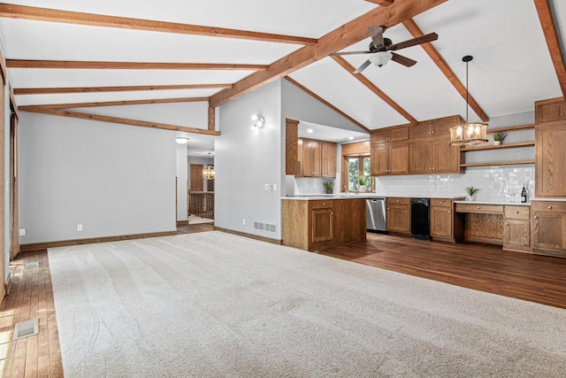 6230 Elm Ridge Cir, Corcoran, MN 55340 - kitchen featuring stainless steel dishwasher, brown cabinetry, open floor plan, ceiling fan, and light countertops