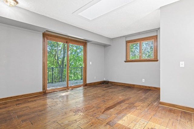 6230 Elm Ridge Cir, Corcoran, MN 55340 - spare room with hardwood / wood-style floors and healthy amount of natural light