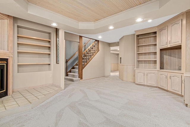 6230 Elm Ridge Cir, Corcoran, MN 55340 - unfurnished living room with a tray ceiling, recessed lighting, wooden ceiling, stairway, and light colored carpet