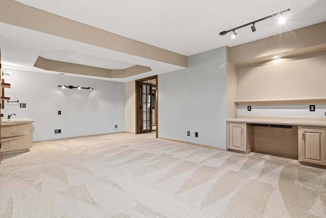 6230 Elm Ridge Cir, Corcoran, MN 55340 - below grade area featuring track lighting and light colored carpet