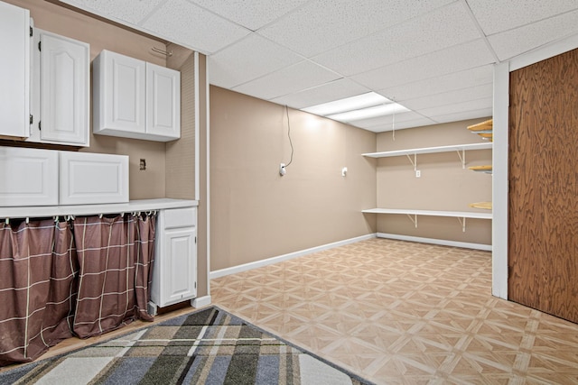 6230 Elm Ridge Cir, Corcoran, MN 55340 - finished below grade area with a drop ceiling and light floors