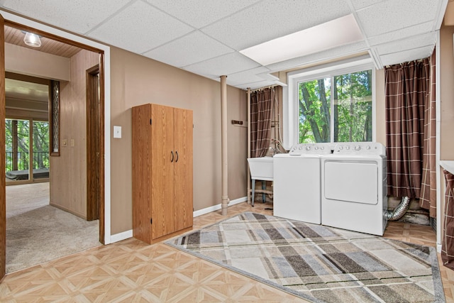 6230 Elm Ridge Cir, Corcoran, MN 55340 - laundry room featuring separate washer and dryer and baseboards