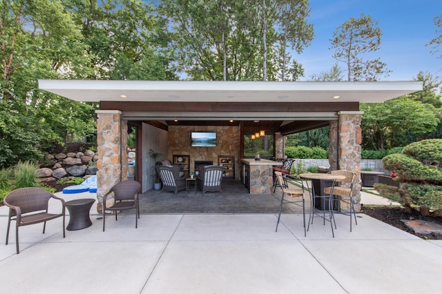 641 Callahan Pl, Mendota Heights, MN 55118 - view of patio with an outdoor stone fireplace