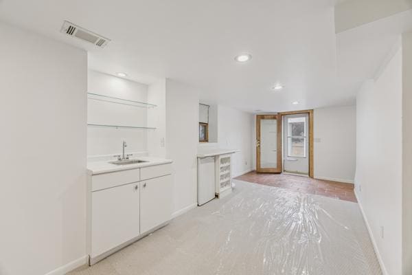 3916 Thomas Ave S, Minneapolis, MN 55410 - kitchen with light countertops, white cabinets, and recessed lighting