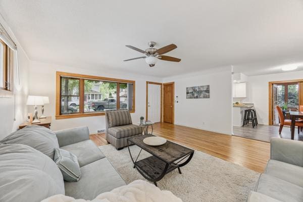 3916 Thomas Ave S, Minneapolis, MN 55410 - living room with a ceiling fan and light wood-type flooring