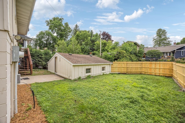 3916 Thomas Ave S, Minneapolis, MN 55410 - fenced backyard with stairway and an outbuilding