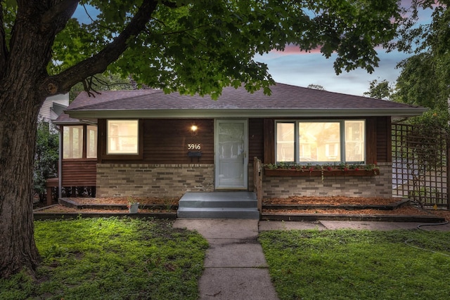 3916 Thomas Ave S, Minneapolis, MN 55410 - view of front facade featuring brick siding and roof with shingles