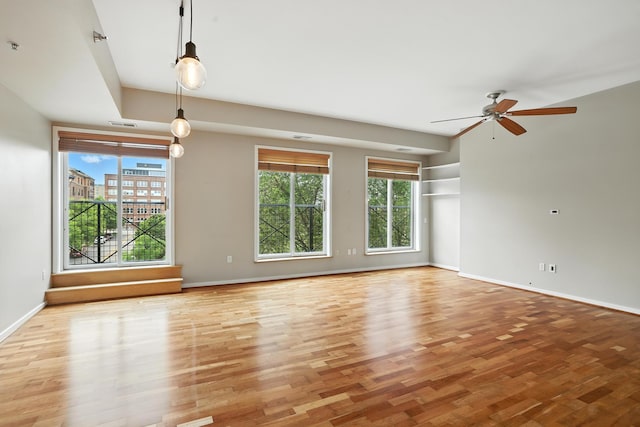 445 Wacouta St Unit 306, Saint Paul, MN 55101 - unfurnished living room with plenty of natural light, wood finished floors, and ceiling fan