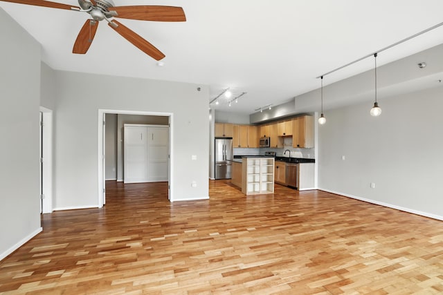 445 Wacouta St Unit 306, Saint Paul, MN 55101 - unfurnished living room with light wood-style flooring and a ceiling fan