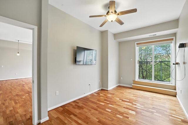 445 Wacouta St Unit 306, Saint Paul, MN 55101 - spare room with light wood-style floors and ceiling fan