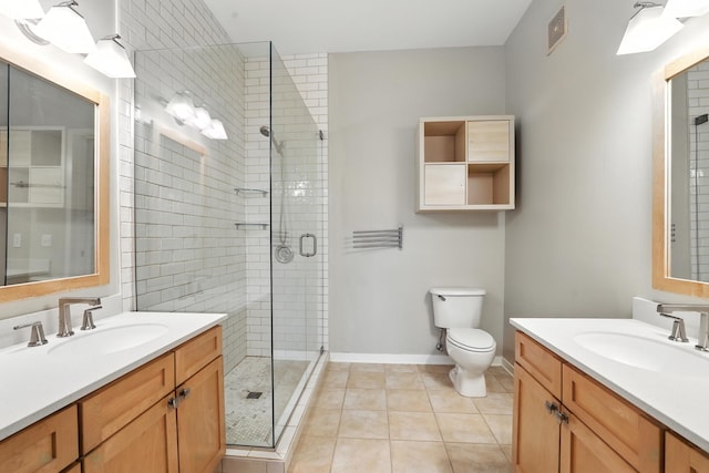 445 Wacouta St Unit 306, Saint Paul, MN 55101 - bathroom featuring two vanities, a stall shower, and tile patterned flooring