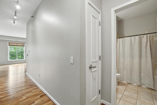 445 Wacouta St Unit 306, Saint Paul, MN 55101 - hall featuring track lighting and wood finished floors